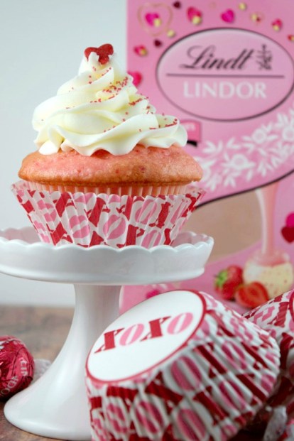 Sweet strawberry cupcakes stuffed with Lindt Lindor Strawberries and Cream Truffles!