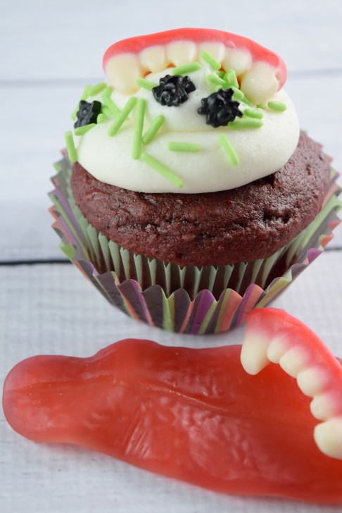 The cupcake that bites back!  Make these creepy fang #cupcakes for #halloween!